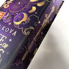 Textausschnitt: "...KOVA," "...CE OF S..." Dunkles Cover mit goldenen und lila Illustrationen von Monden und Sternen.
