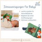 "Sinnesanregungen für Babys. Leicht zu greifen für kleine Babyhände. Begleitet die ersten Greifbewegungen. Schmusebuch"