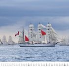Das Bild zeigt ein großes Segelschiff mit vielen Segeln, darunter ein kleiner Kalender für Mai.