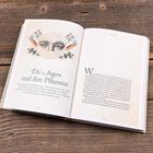 "Die Augen und ihre Pflanzen" steht groß über einem Text. Ein Auge, umgeben von Blumen-Illustrationen, ist prominent abgebildet.