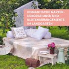 Text: "ROMANTISCHE GARTENDEKORATIONEN UND BLÜTENARRANGEMENTS IM LANDGARTEN". Eine gemütliche Gartenszene mit Decke, Kissen und Blumen.