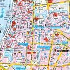 Eine detaillierte Karte von Düsseldorf mit Straßennamen, U-Bahnlinien und Sehenswürdigkeiten entlang des Rheins.