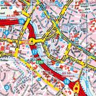 Karte von Saarbrücken mit Straßennamen, Autobahnen, Grenzübergang, und DB-Logo. Gelbe Linien zeigen Verkehrswege.