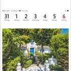 Kalenderwoche 22: 31. Mai bis 6. Juni. Foto eines Friesenhauses mit Garten und blauem Eingangstor.