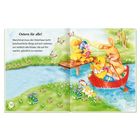 Seite 14-15: "Ostern für alle!" Text über den Osterhasen. Illustration: Ein Hase rudert Entenküken auf einem Fluss.