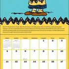 Text: "Charlie Brown", "DEBUT: 10-2-1950", "April". Illustration eines freundlichen Jungen in gelbem Hemd auf blauem Hintergrund.