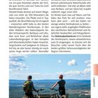 Seite mit Text über Nationalparks in Salla. Foto: Zwei Mountainbiker stehen mit Fahrrädern auf einem Hügel mit Weitblick.