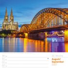 Text: 35. Woche, August/September 2027. 
Motiv: Hohenzollernbrücke und Dom in Köln bei Dämmerung.
