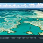 Kalenderseite für Juli mit großem Foto des Great Barrier Reefs in Australien. Türkisblaues Wasser und Korallenformationen.