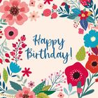 "Happy Birthday!" steht in der Mitte, umgeben von bunten Blumen und Blättern in Rot, Blau und Grün.