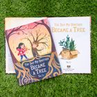 Buchdeckel zeigt ein Kind und einen Baum mit einem Gesichtsansatz. Der Titel lautet: "The Day My Brother Became a Tree" von Xin Li.