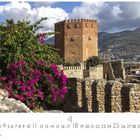 Text: "Alanya", Zahlen unter einem Kalenderbild.  
Darin ein alter Turm mit rosa Bougainvillea.