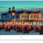 Seebrücke Sellin im Morgenlicht. Kalenderblatt mit Strandkörben am Strand und einem Gebäude auf einer Seebrücke bei Sonnenaufgang.