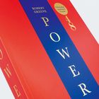 "Robert Greene POWER 48. Vollständige, ungekürzte Ausgabe." Rotes und blaues Buchcover mit gelber Schrift.