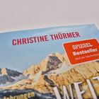 "CHRISTINE THÜRMER" in Rot, "SPIEGEL Bestseller" in einem orangen Rechteck. Hintergrund: Berglandschaft.