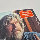 „SPIEGEL Bestseller-Autor“ und „MALIK“. Ein Mann mit grauem Haar blickt nachdenklich.