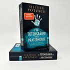 "Der Totengräber und die Pratermorde" von Oliver Pötzsch. Bücherstapel mit "Spiegel Bestseller"-Aufkleber.