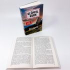 Ein Buch mit dem Titel "Milchgeld" von Klüpfel Kobr, aufgeschlagen auf Seite 140 und 141.