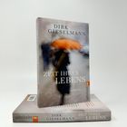 "Dirk Gieselmann: Zeit Ihres Lebens. Ullstein-Logo. Buch mit verschwommenem Bild einer Person mit orangefarbenem Regenschirm."