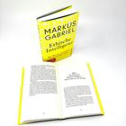 Buchtitel: "Ethische Intelligenz" von Markus Gabriel. Ein aufgeschlagenes Buch zeigt Seite 104 und 105.