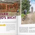 "STEILER WIRD'S NICHT ... auf dem Stoneman durchs Westerzgebirge #48." Zwei Mountainbiker fahren einen Hügel hinauf.