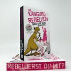Die Texte lauten: "REBELLIERST DU MIT?", "DIE KÄNGURU-REBELLION", "ILLUSTRIERTE AUSGABE". Eine Illustration zeigt ein Känguru mit Spraydose.