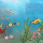 Text beschreibt Krabbe Krabbi, die Ferri auslacht. Illustration von Krabben, Fischen und Pflanzen im Meer.