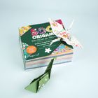 "500 Origami - Die Welt der Blumen. Kreative Anleitungen und hochwertiges Papier." Zwei Origami-Figuren, Kranich und Blume.