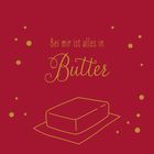 Text: "Bei mir ist alles in Butter". Illustration von Butterstück auf rotem Hintergrund mit goldenen Punkten.