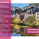 „Nicht verpassen!“ Oben links. Liste mit Sehenswürdigkeiten in Luxemburg. Häuser am Flussufer bei Abenddämmerung.