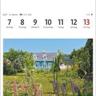 "Juni, 23. Woche, 7. bis 13." zeigt ein Datum. Darunter ein Garten mit bunten Lupinen und ein blaues Haus im Hintergrund.