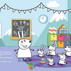 Eine Lehrerin erklärt Kindern etwas über Babys. Bunte Klassenzimmerdekoration mit Sonne und Regenbogen.