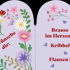Herzförmige Illustration mit Blumen, Schmetterlingen und folgendem Text: „Ich wünsche dir: Brause im Herzen, Kribbeln im Bauch, Flausen im Kopf“.