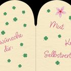 Text auf herzförmiger Karte: "Ich wünsche dir: Mut, Kraft, Selbstvertrauen." Mit Kleeblättern und Blume verziert.