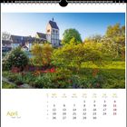 April, Kalenderblatt mit Tagen und Wochen. Im Hintergrund blühender Garten mit Kirche und bunten Blumen.
