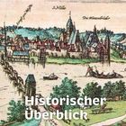 Texte: "Historischer Überblick", "Von Werner Benecke", "S. Nicolai", "Die Mönchsbrüder". Illustration einer mittelalterlichen Stadt.