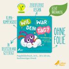 Text: "Wie war dein Tag?", "Zertifiziert vegan", "Echt nachhaltig", "Klimakompensiert", "Ohne Folie", "In Deutschland gefertigt". Illustration: Lilafarbenes Wesen auf einer Wolke.