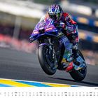 Text: "APRIL", "GP Frankreich (Circuit Bugatti, Le Mans)". Ein Motorradfahrer in voller Geschwindigkeit auf einer Rennstrecke.