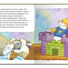 Ein Mäusekind in blauem Shirt baut eine bunte Bausteinburg, während es fotografiert wird.