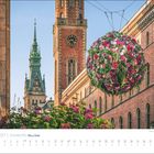 April 2027, Hamburg, Meine Stadt. Eine große Blumeninstallation hängt zwischen historischen Gebäuden.