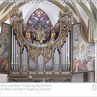 Basilika St. Ulrich und Afra in Augsburg, Orgel mit aufwendigen, goldenen Verzierungen und religiösen Gemälden.