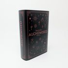 Der Text auf dem Buch lautet "SenLinYu ALCHEMISED Roman". Schwarzer Einband mit rotem geometrischem Muster und Symbolen.