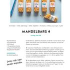 Texte: "Henry", "Lea", "Lotta", "Theo", "Ani", "Ben", "Mandelbars", "nussig und süß", Rezept für Müsliriegel. Sechs Müsliriegel auf karierter Unterlage.