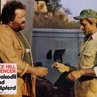 Text: "Terence Hill Bud Spencer Das Krokodil und sein Nilpferd". Zwei Männer geben sich draußen die Hand.