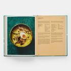 Links "Tempeh Laksa", rechts Rezept. Bild einer Schüssel mit Suppe, Ei und Toppings auf dunklem Untergrund.