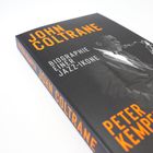 „John Coltrane: Biographie einer Jazz-Ikone“ in Orange; darunter der Autor Peter Kemper. Cover zeigt Coltrane mit Saxophon.