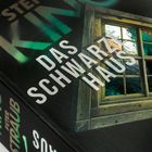 Text: "Das schwarze Haus", "Stephen King", "Peter Straub", "Heyne". Cover mit Fenster und mystischem Waldhintergrund.