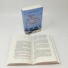 Auf dem Cover: "Hinter den Dünen warten die Träume" von Jette Jacobson. Ein Roman. Offenes Buch zeigt die Seiten 178-179.
