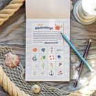 "Mein Küstenbingo" steht oben. Darunter: Eine Tabelle mit maritimen Symbolen und Kreuzen. Muscheln und ein Seil außen herum.