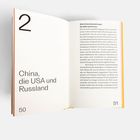 Seite 50: "China, die USA und Russland". Seite 51: Text über internationale Beziehungen, Ukraine, Russland, USA, China.
